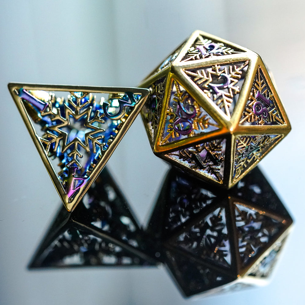 gold d4 and d20 on a reflective dark surface