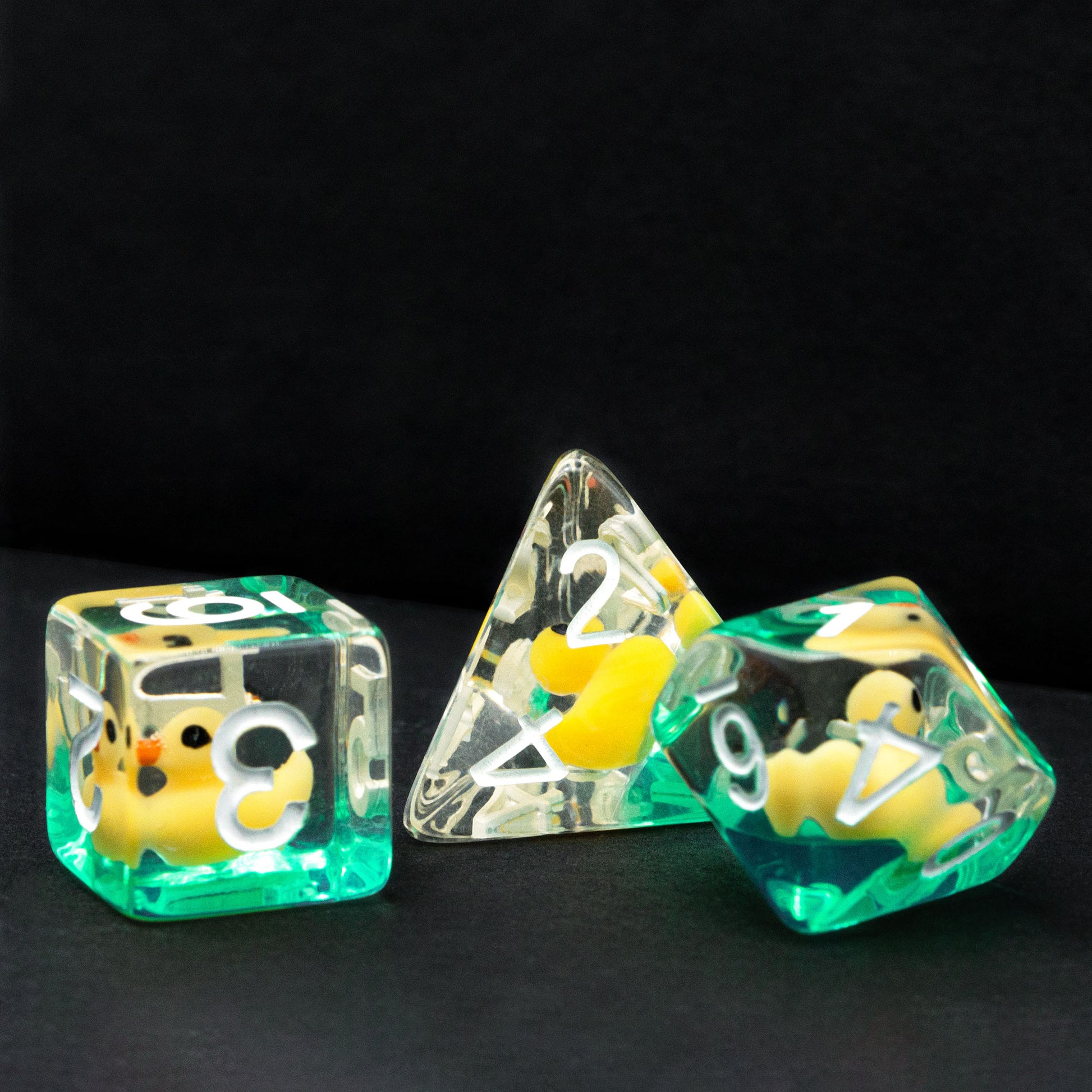 d6, d4 and d10 ducky dice with black background