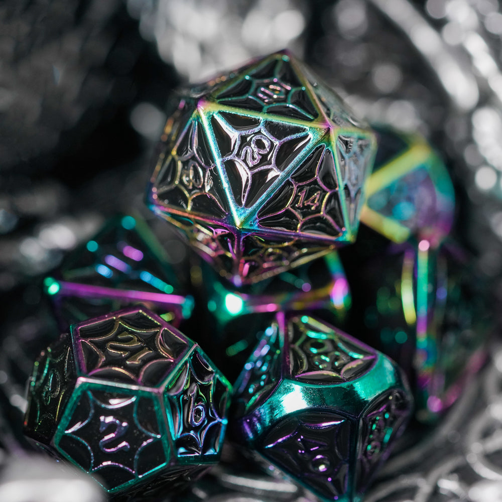 colorful d20 on top of rest of dark metal dice set