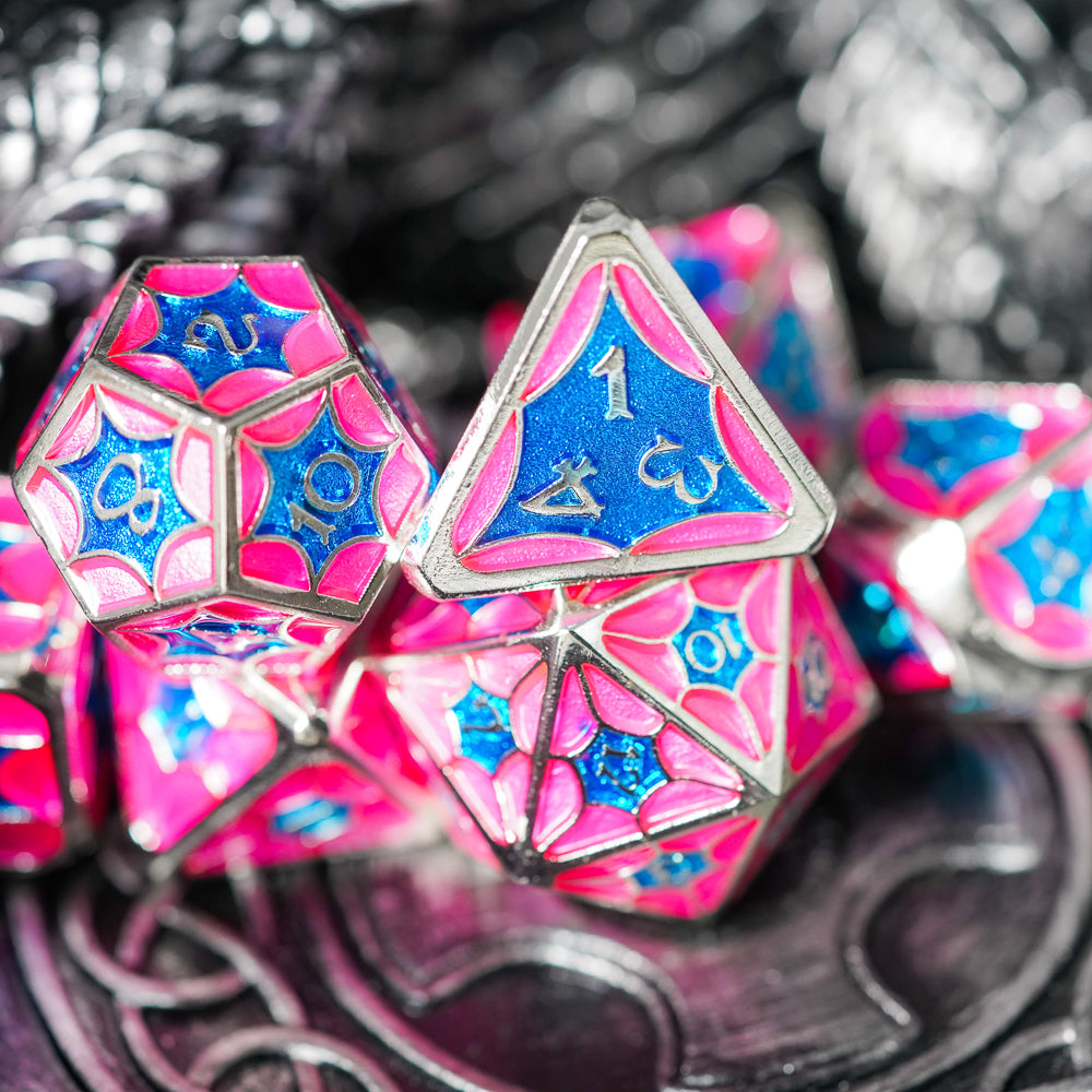 pink metal d4 and d12 sticked on top of a d20
