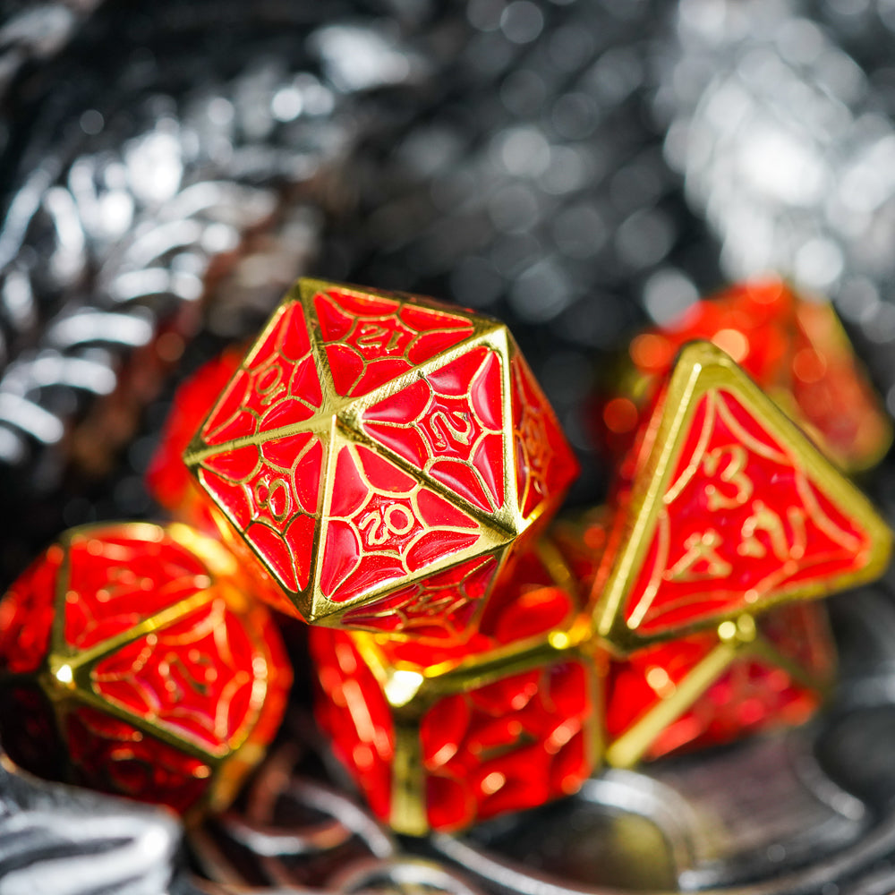 Red and gold metal d20 die