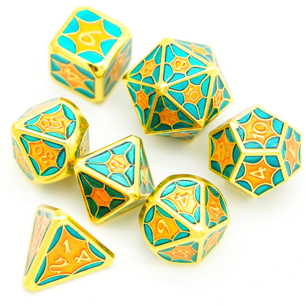 Topview of gold, orange and blue metal dice on white background