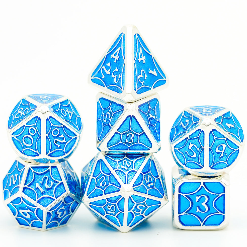 Hollow metal dice set, blue, stacked on top of one another