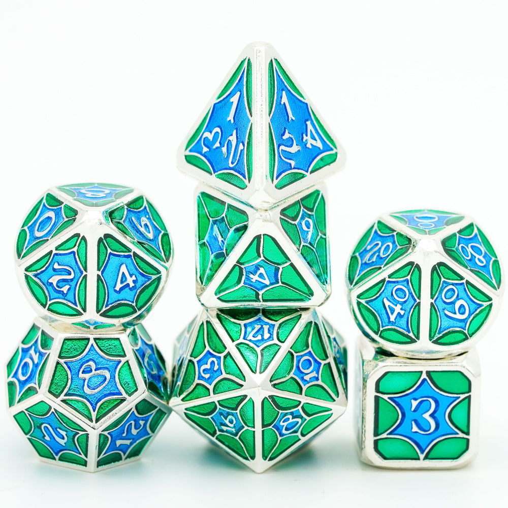 7 piece green and blue metal dice set stacked