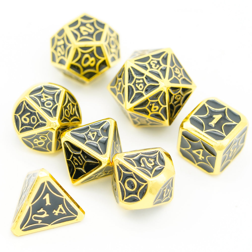 Top view of gold and black metal dice 7 piece set