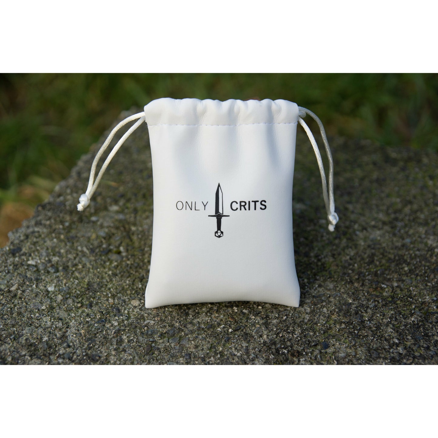 complimentary white Only Crits dice bag