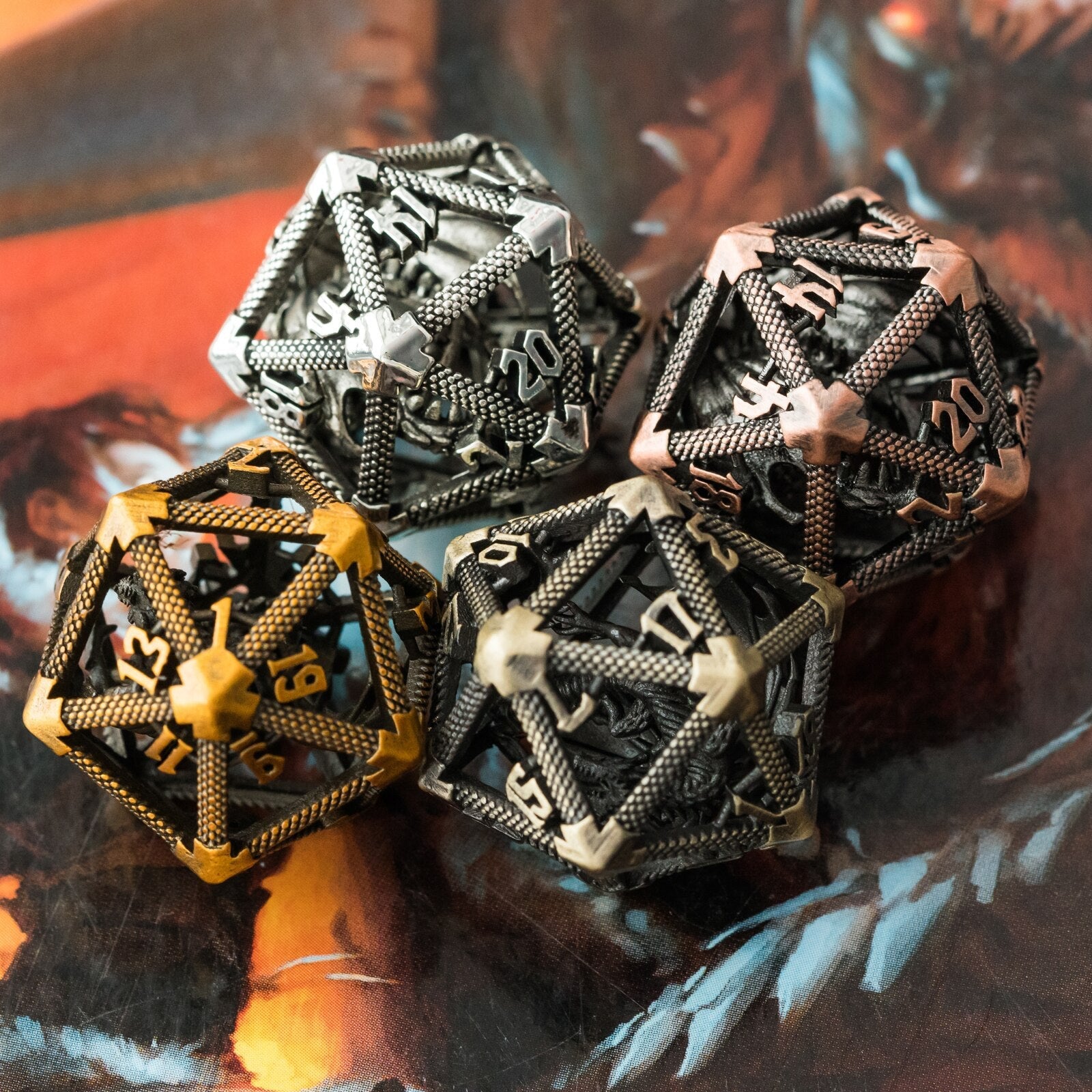 Four different colored hollow metal d20s on Player's Handbook
