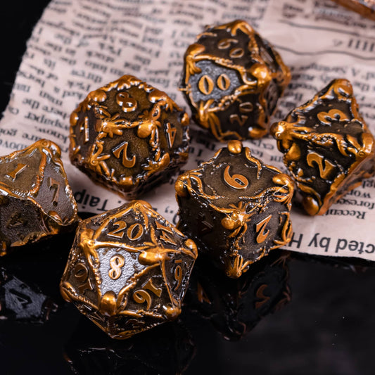 Bronze colored octopus dice on newspaper