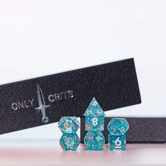 Icy Shard dice set stacked with only crits carrying case in the background