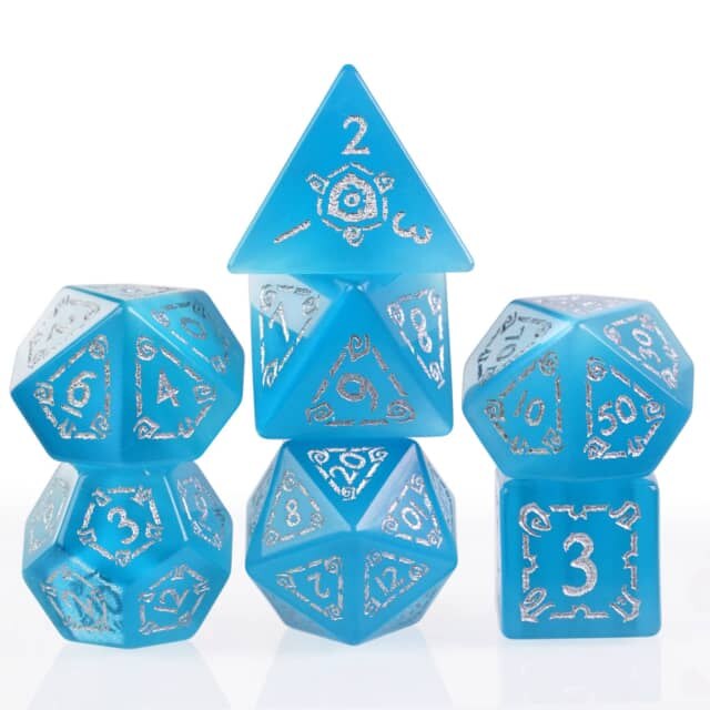 light blue inscripted stone dice