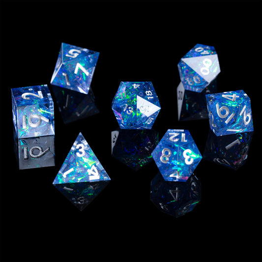 7 piece blue sharp edged DnD dice set with white numbers