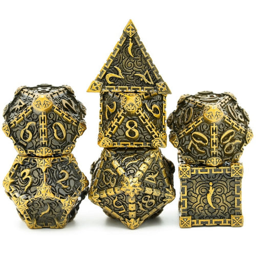 Gold Blade metal dagger dice set stacked for display, black and gold engraved design for DnD and tabletop RPG