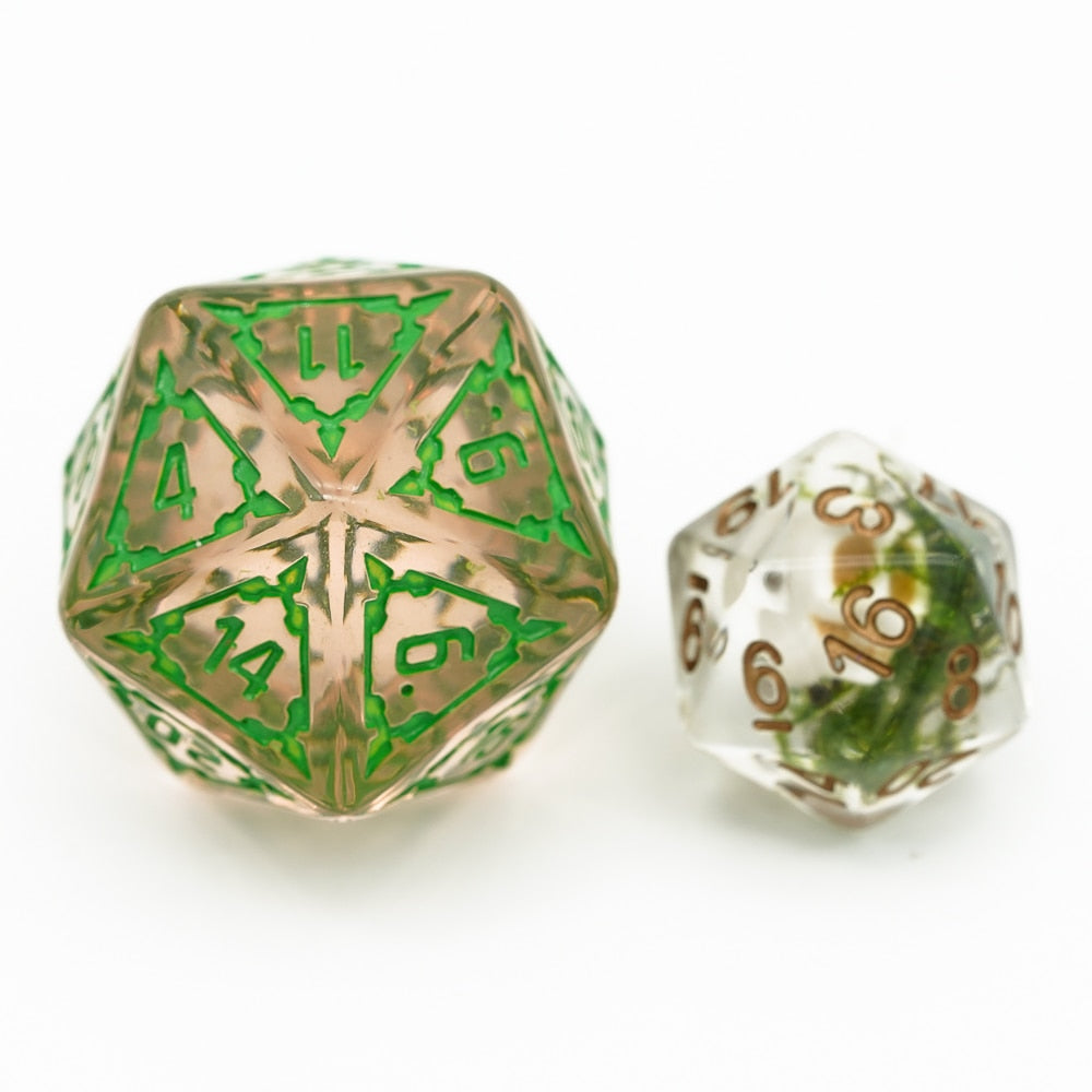 huge d20 sitting next to regular d20 for comparison