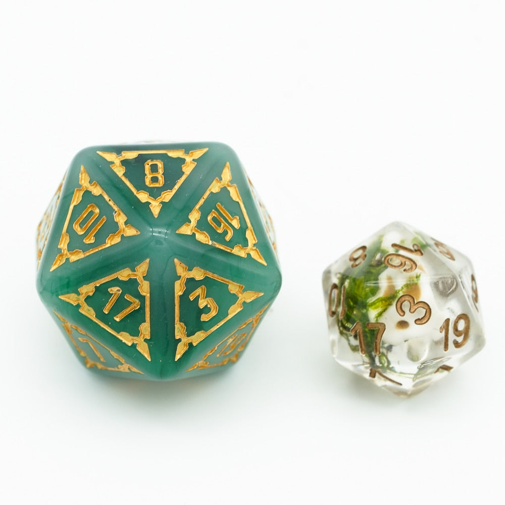 Huge d20 next to regular d20 for size comparison