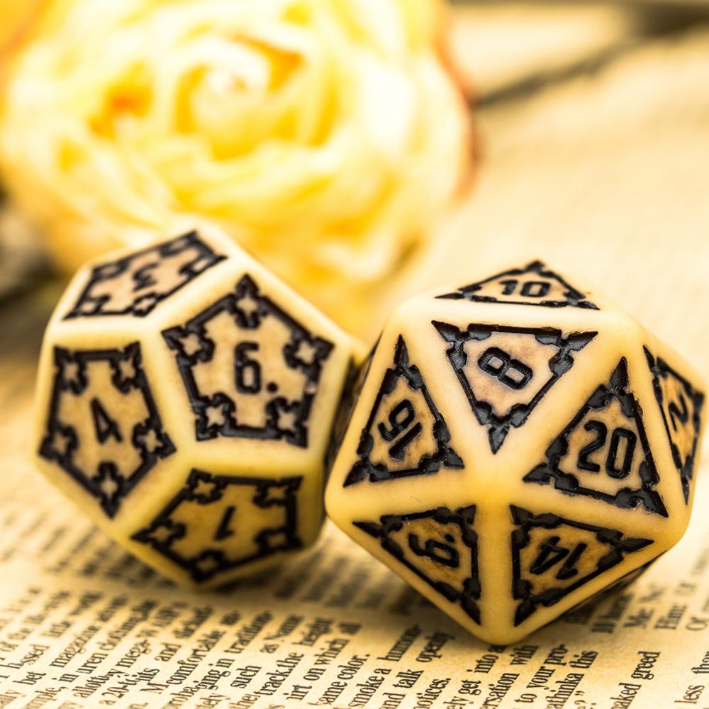 d20 and d12 dice, yellow with black numbering
