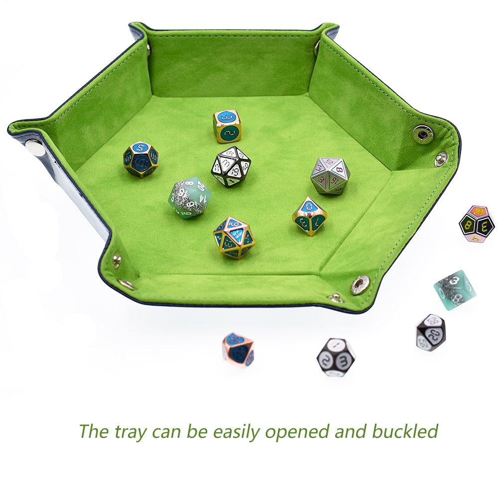 half unbuttoned green dice tray with dice inside, text reading "The tray can be easily opened and buckled" beneath