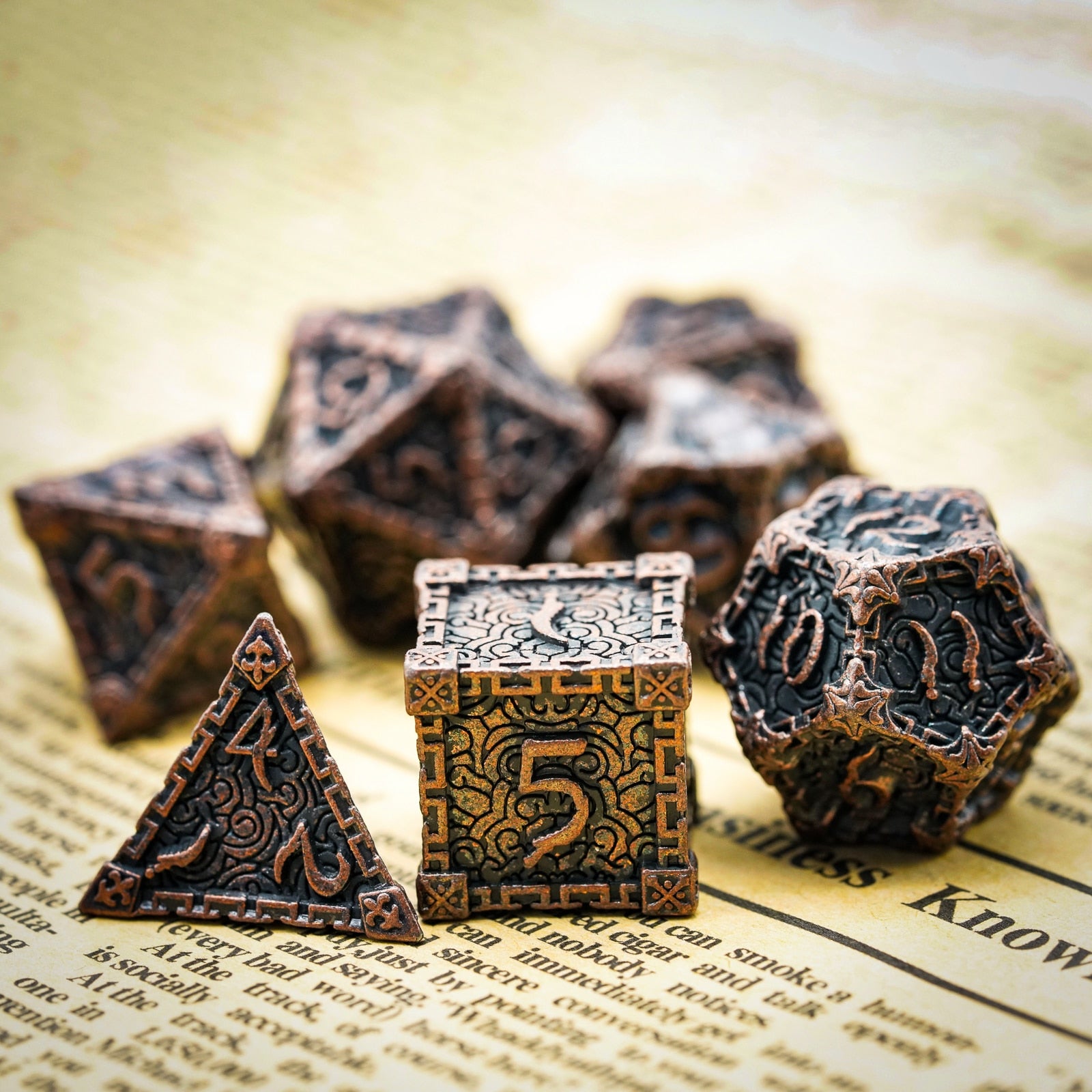 d6, d4 and d 12 bronze metal dice feature on page background