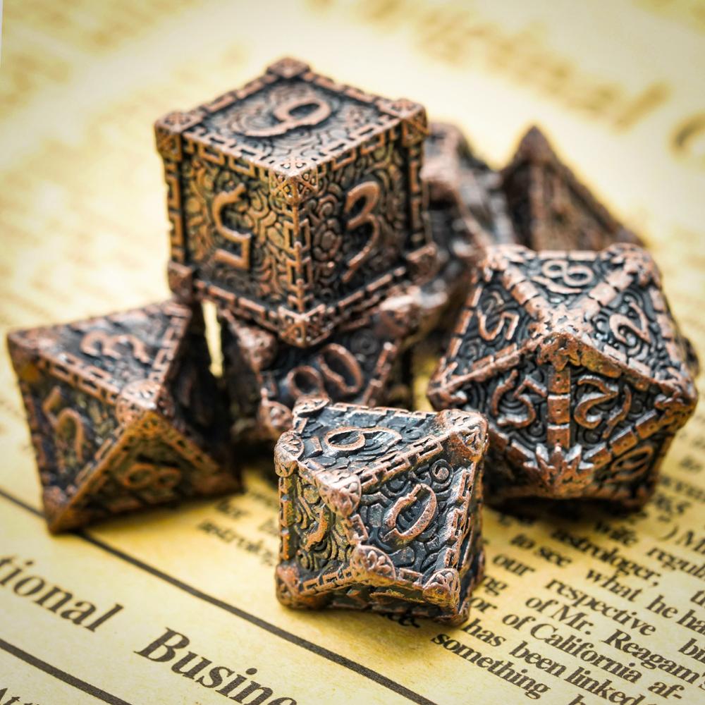 Bronze blade metal dice set on page background