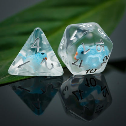 d4 and d20 on leaf background, blue birds in dice