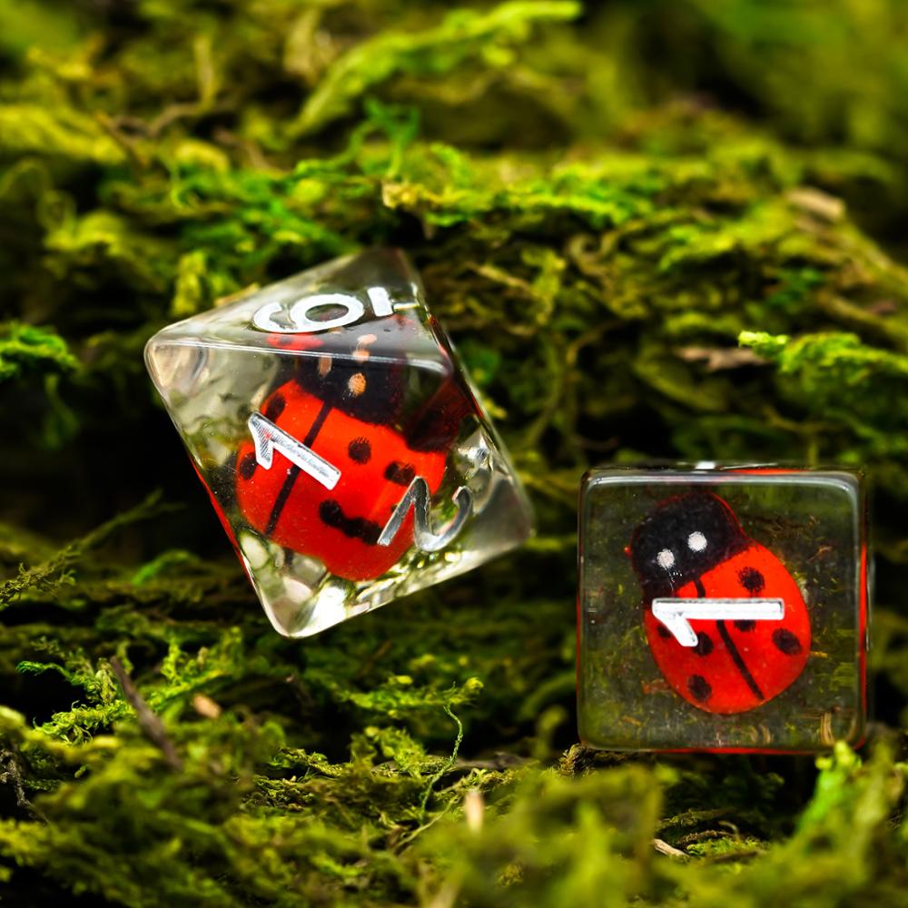 d8 and d6 dice highlight, ladybug dice with moss background