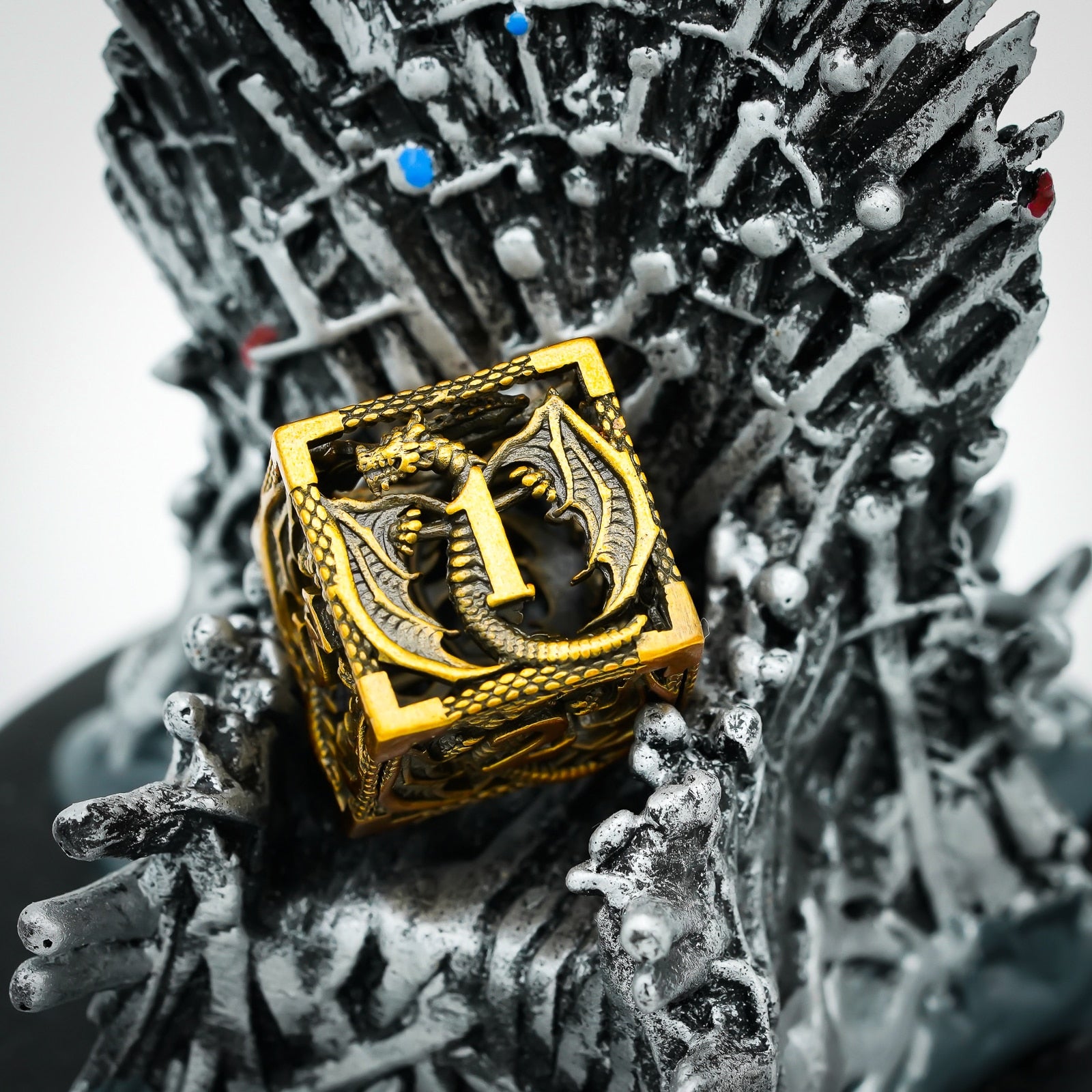 beautiful gold dragon d6 on the Iron Throne