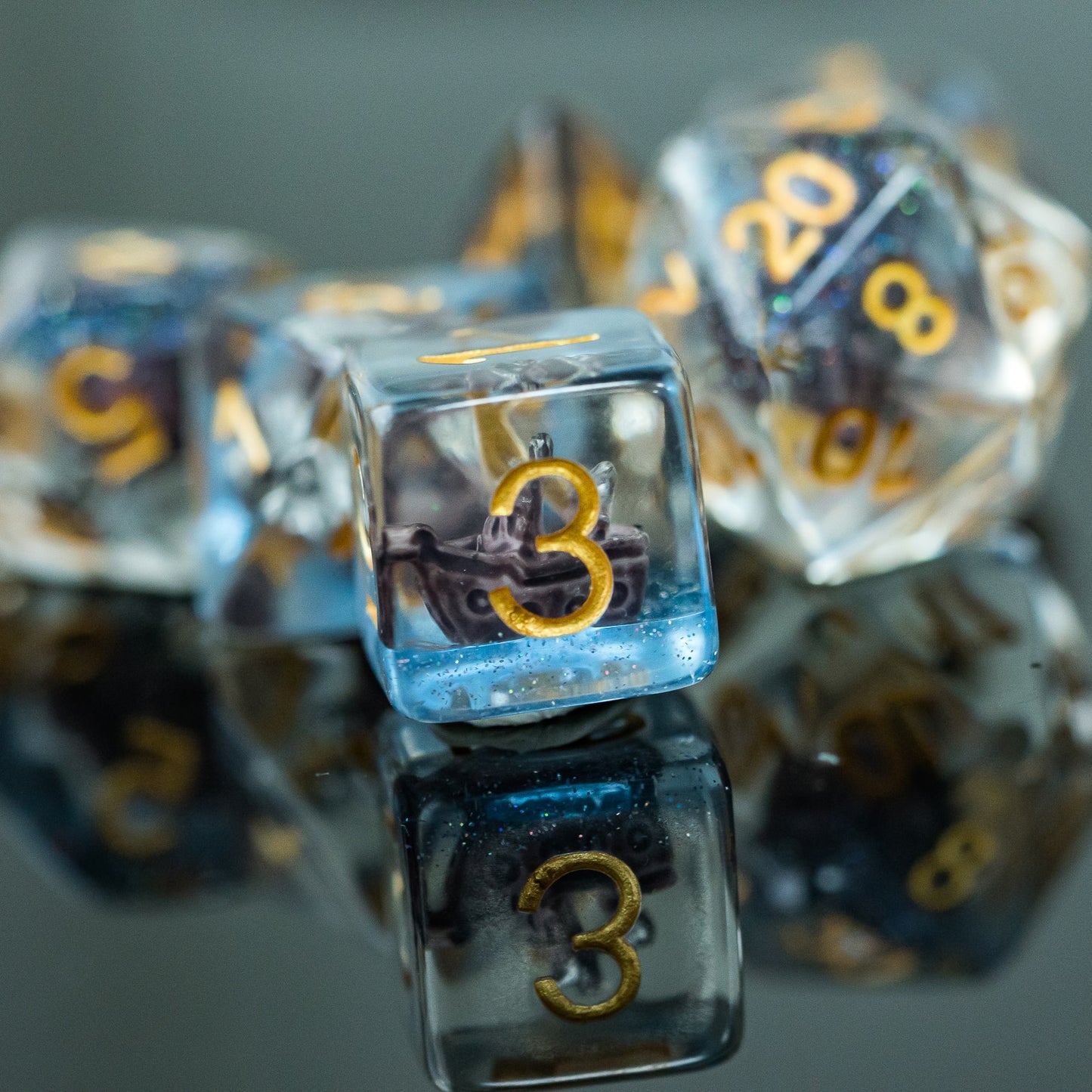 d6 highlight, clear blue resin dice with sailboat inside