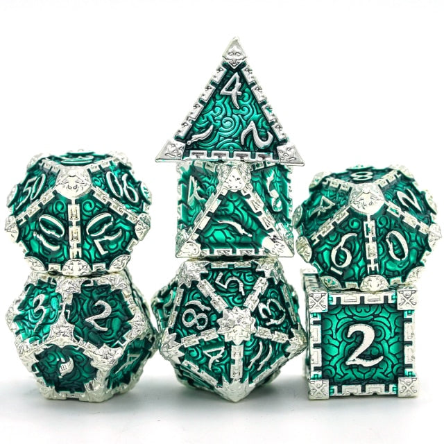 7 piece metal dice set, green with silver filigree and numbers