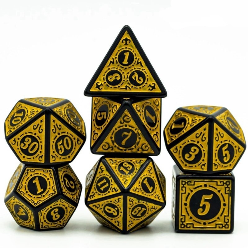 Full Runic Wonder yellow & black metal dice set with intricate rune engravings for DnD & DnD 5e