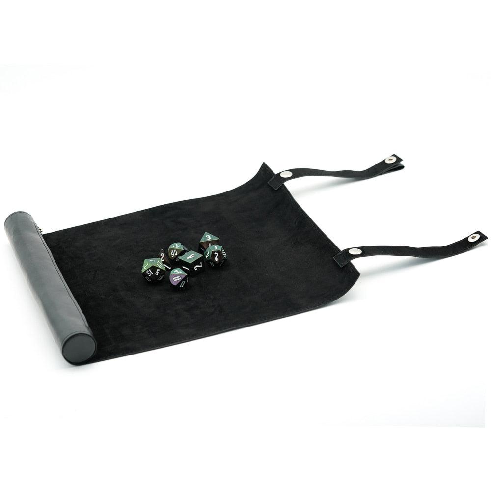 Black suede Spell Scroll dice tray open with dice placed on the surface