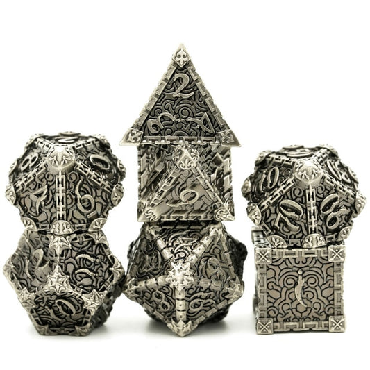 Stone Blade metal dagger dice set stacked for display, silver engraved design for DnD and tabletop RPG